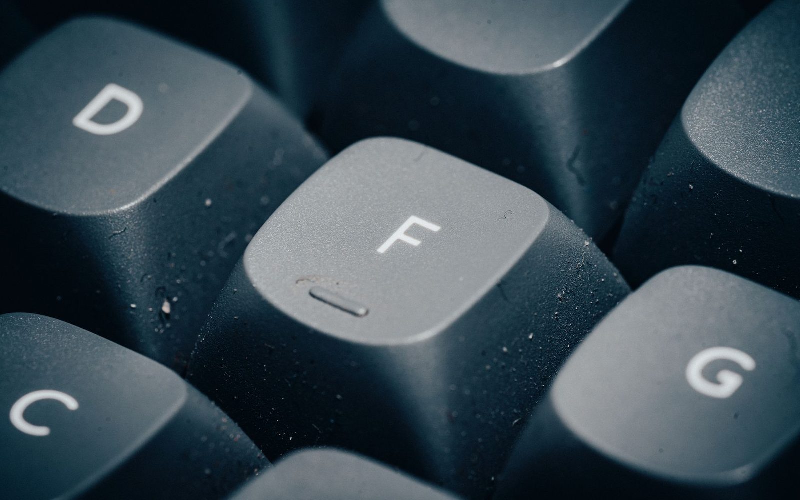 Mechanical keyboard keys in grainy monochrome close-up